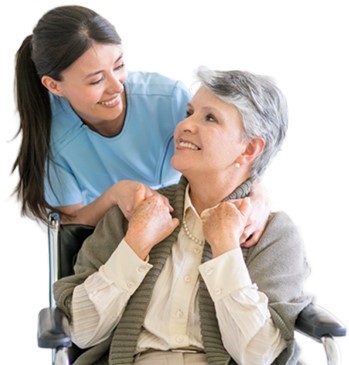 Caregiver talking with elderly in wheelchair